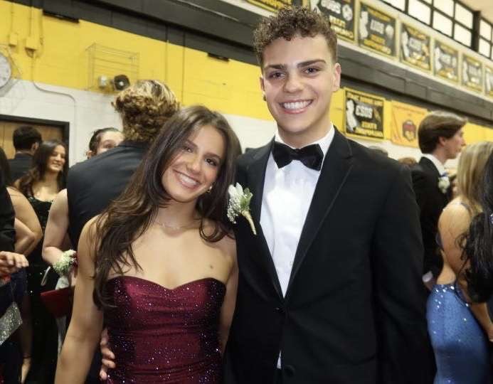 Charlie Kavan and Natalie Spitzer pose in what is, perhaps, the quintessential prom photo.
