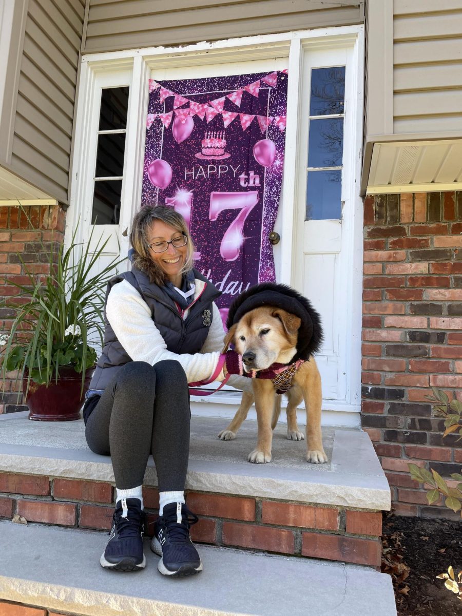 Ang and "her puppy" pose for a birthday picture.