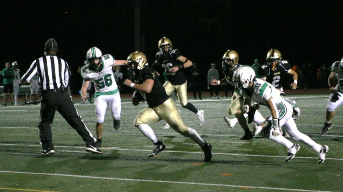 Cain Lanza rushes the ball against PV setting up a touchdown later in the drive.