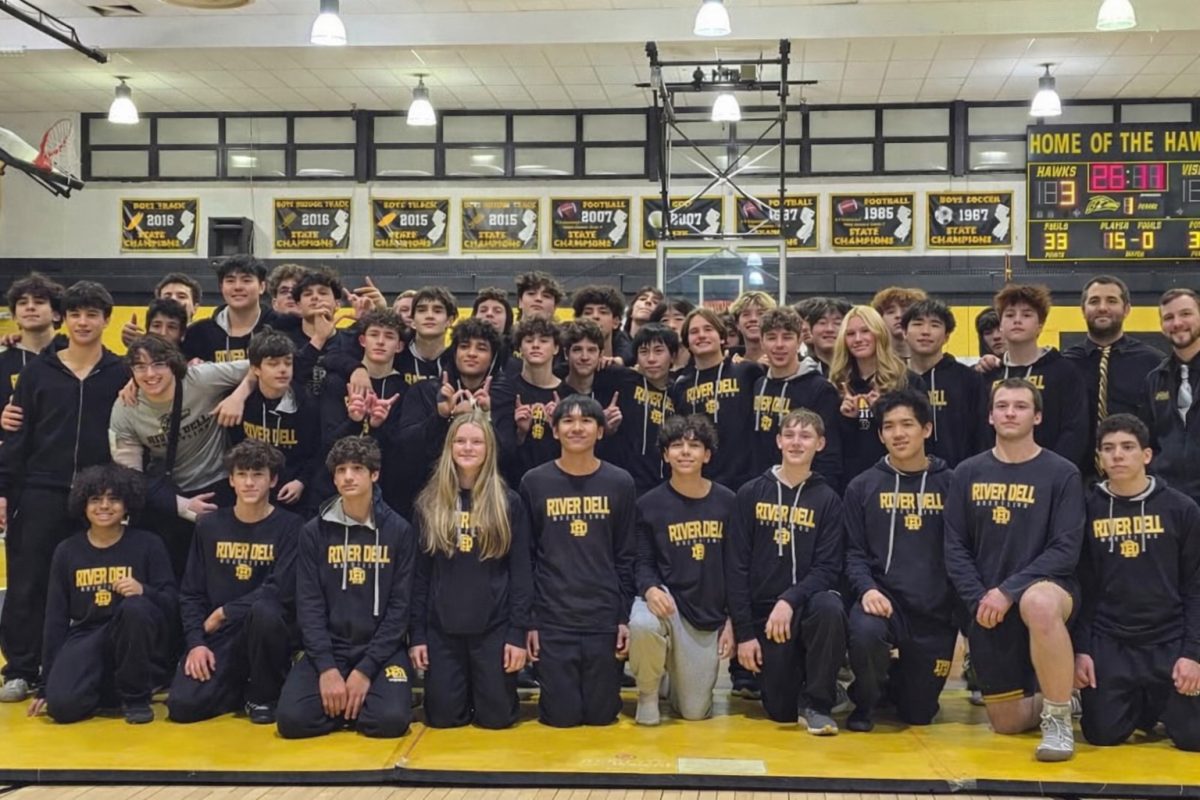 The entire wrestling team poses after their win over Westwood.