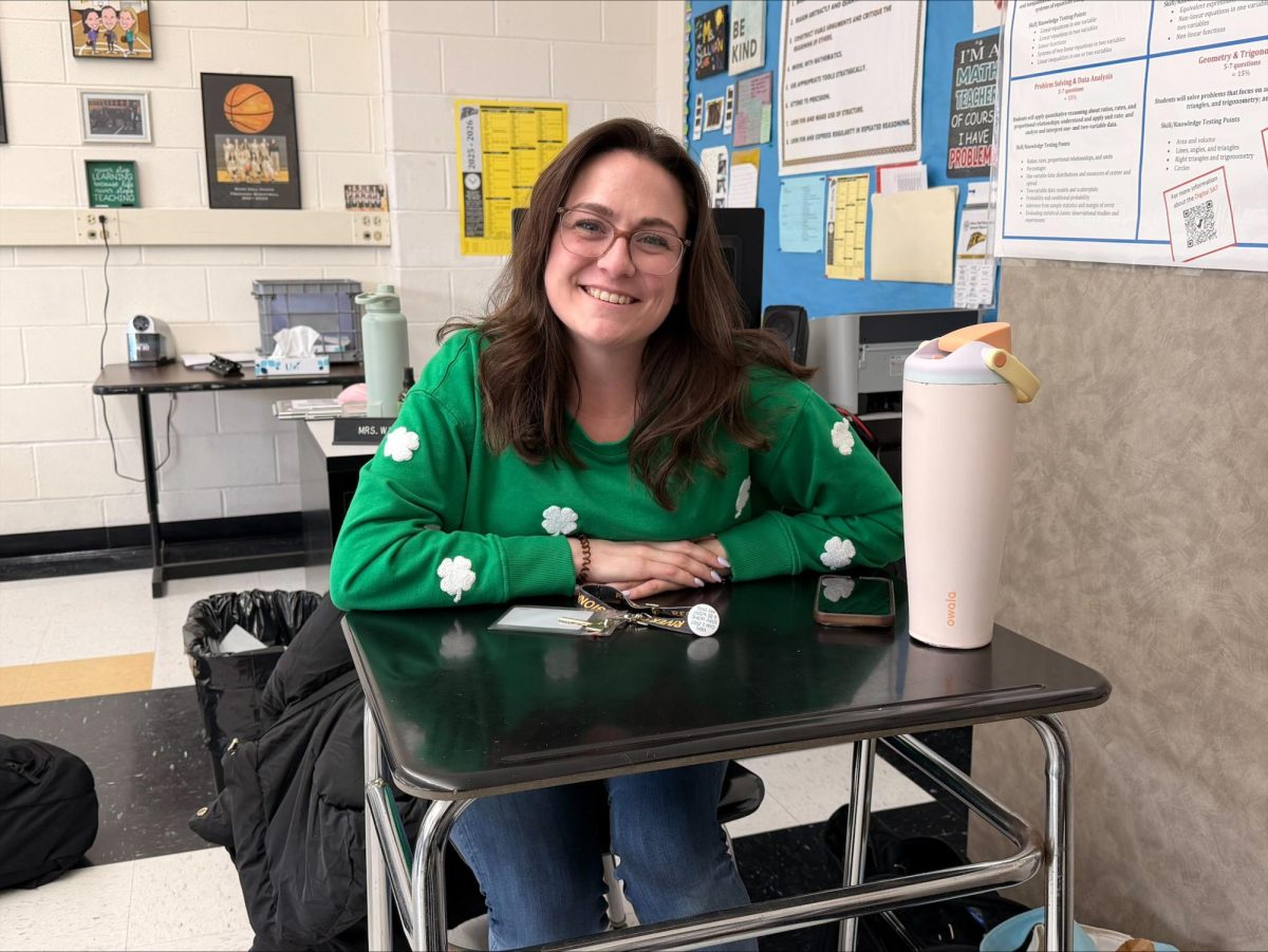 Ms. Simunovich sits at the ready in her St. Patrick's day attire.